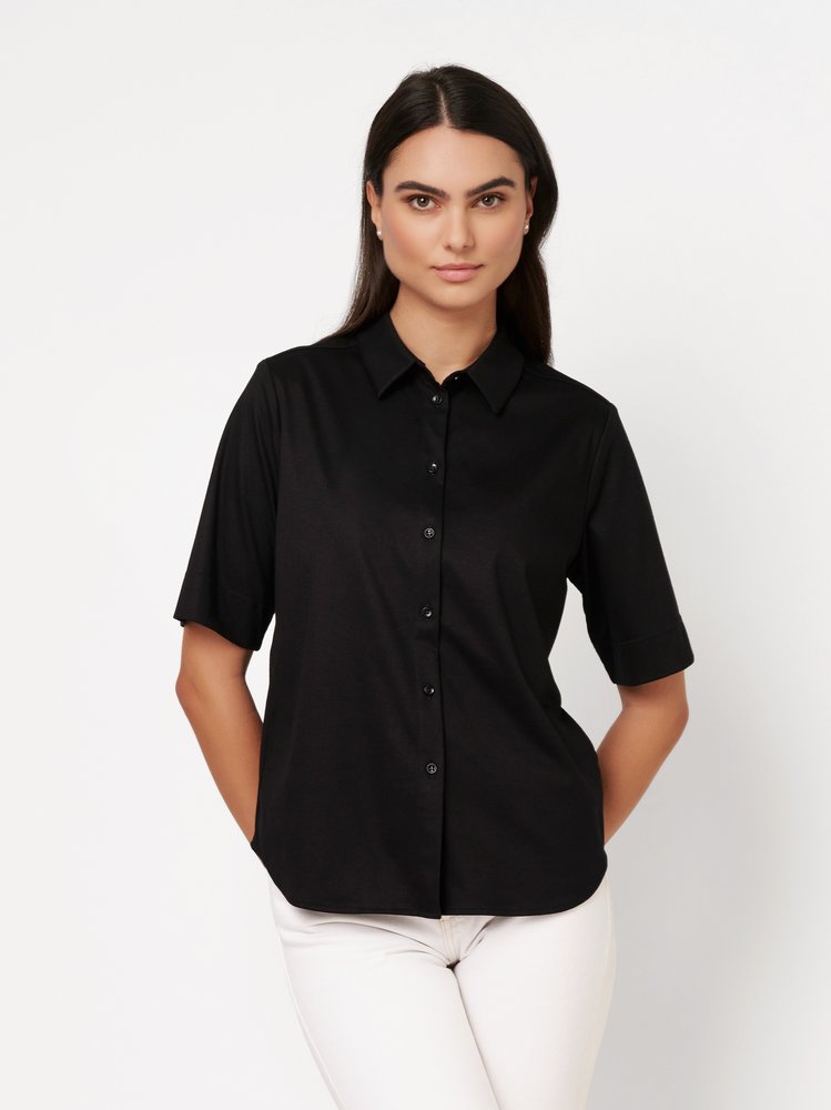 Womens blouse Lizzy in solid black, front view worn by model