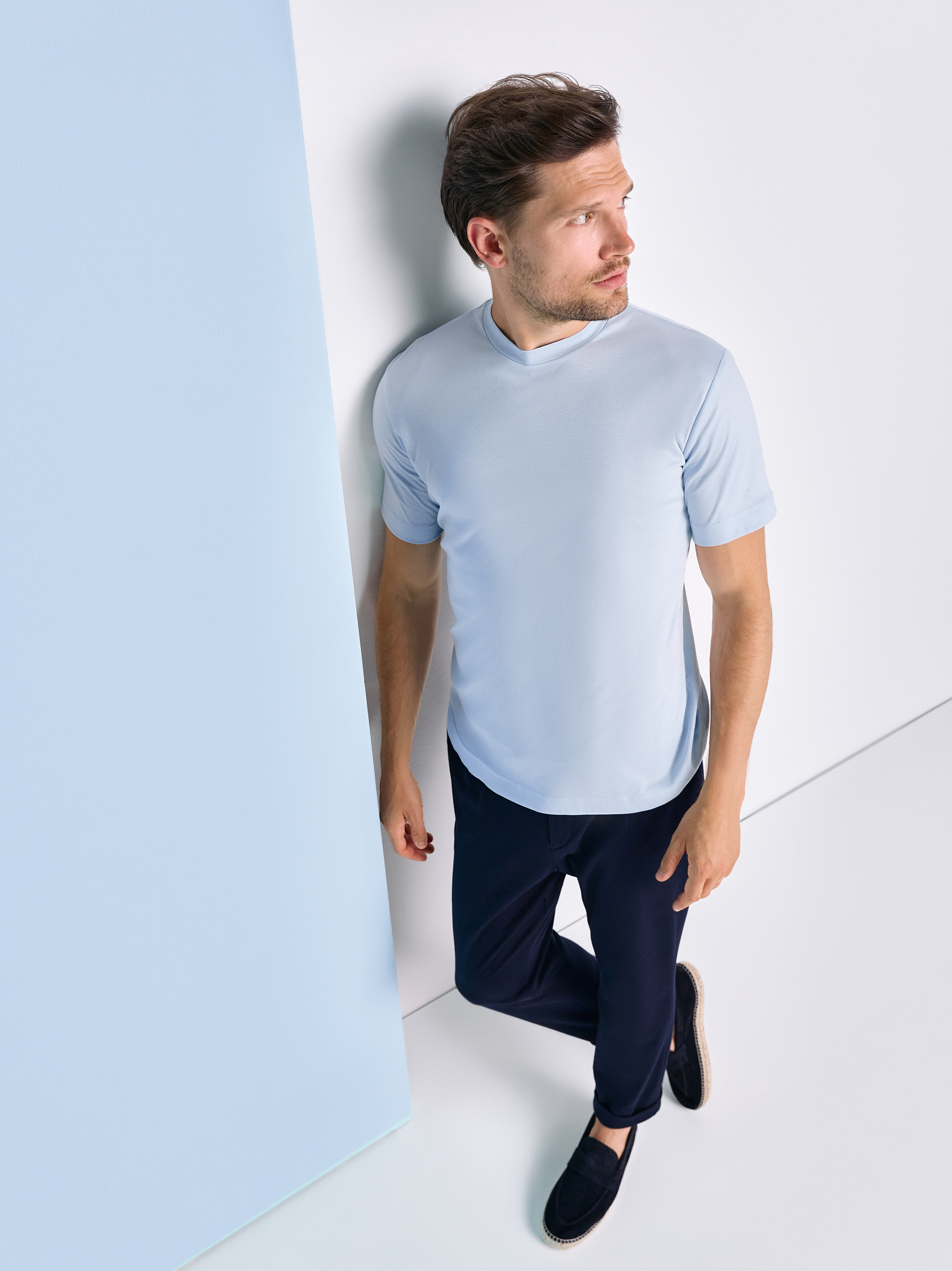 Mens T-shirt casual roundneck in solid light blue, outfit view worn by model