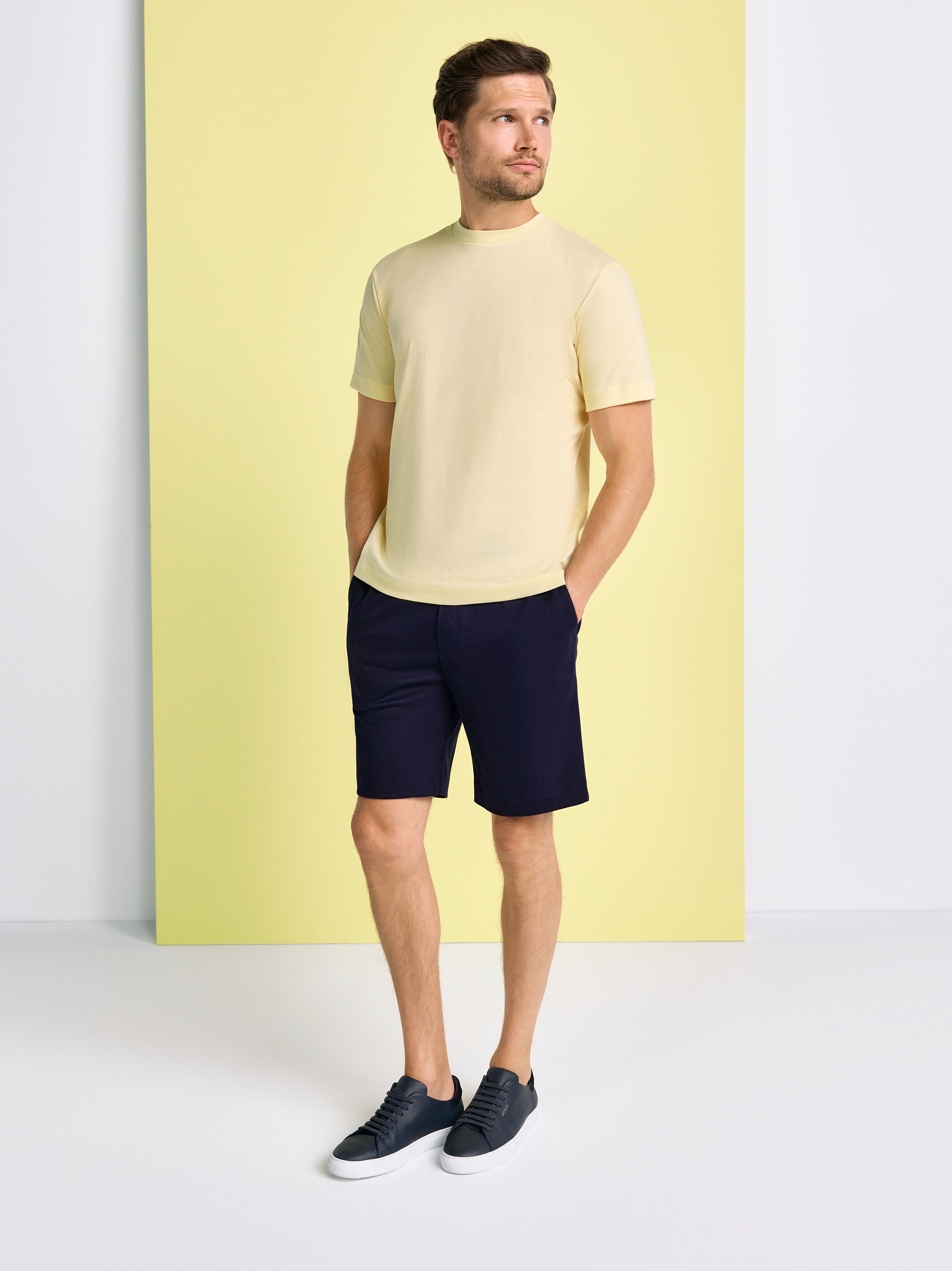 Mens T-shirt casual roundneck in solid yellow, outfit view worn by model