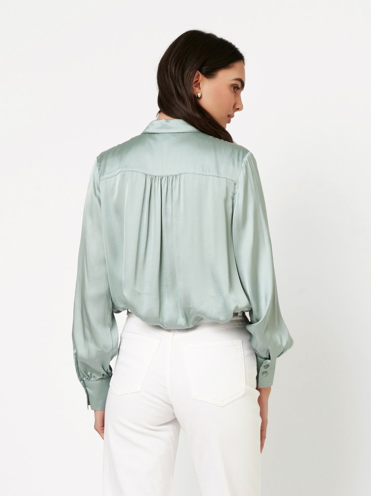 Womens blouse Lena in aloe, back view worn by model