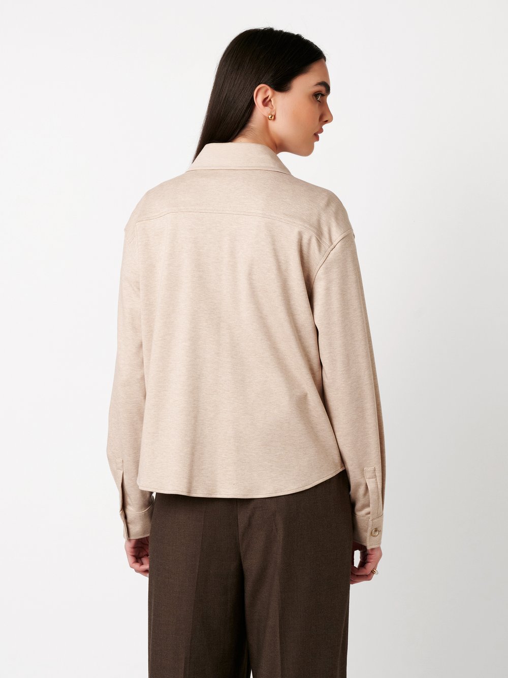 Womens blouse Sina in beige, back view worn by model