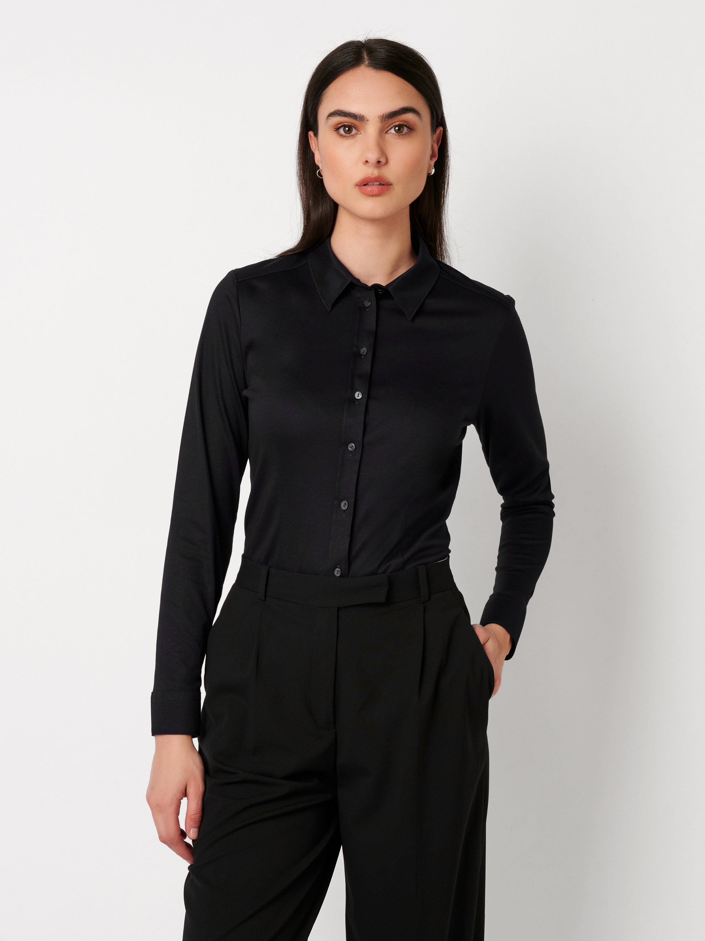 Womens blouse Pia in solid black, front view worn by model