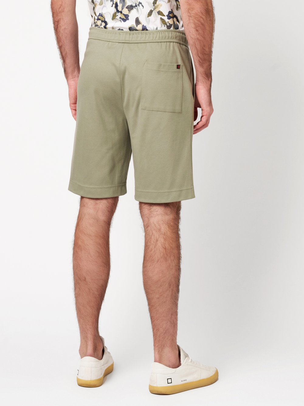 Mens shorts casual in solid green, back view worn by model