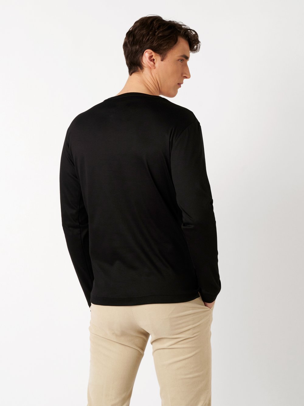 Mens polo shirt casual henley in solid black, back view worn by model