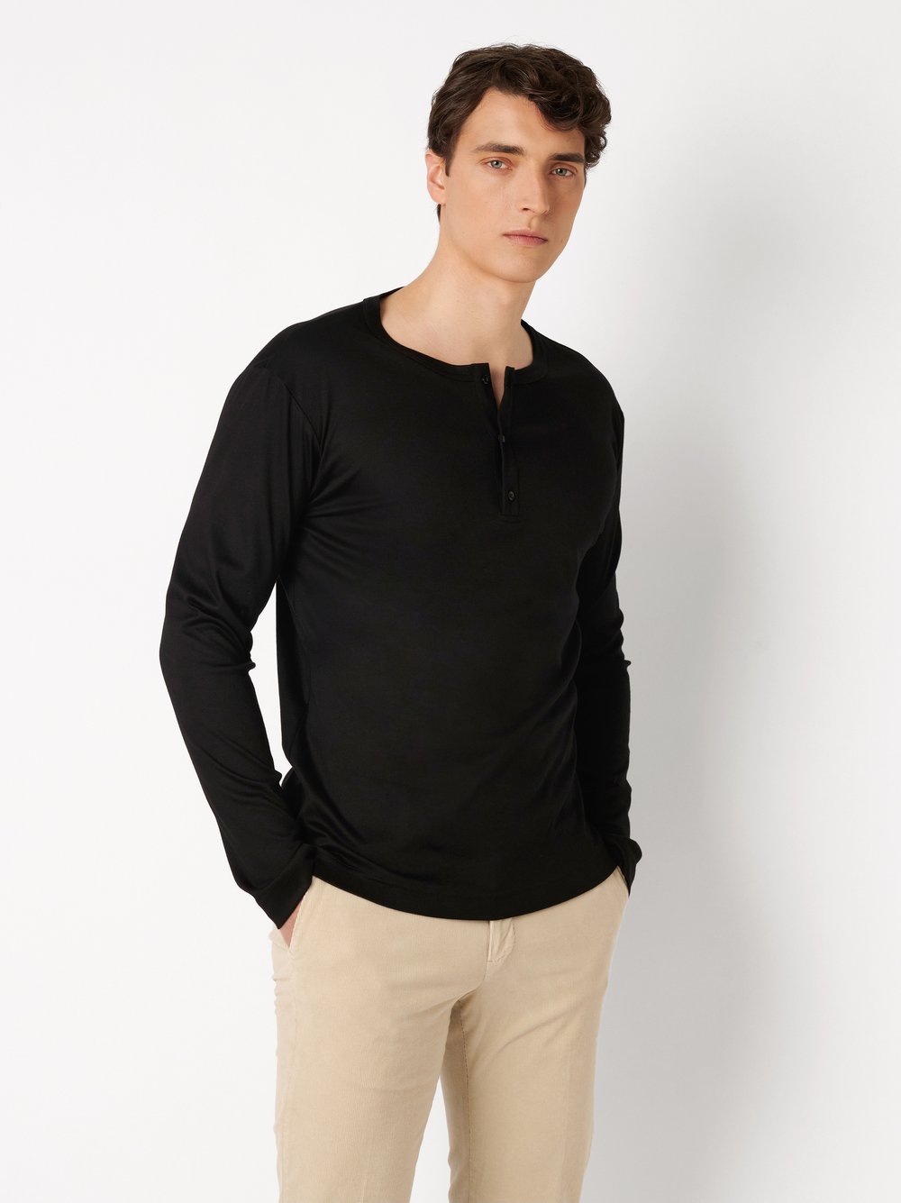 Mens polo shirt casual henley in solid black, front view worn by model
