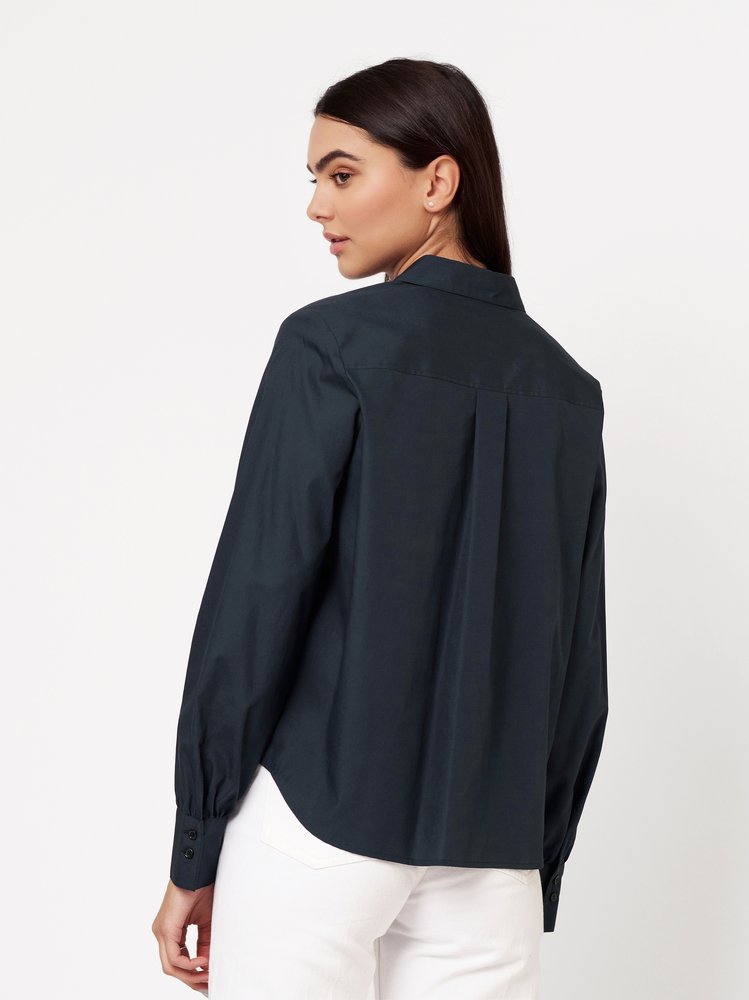 Womens blouse Lizzy in solid true navy, back view worn by model