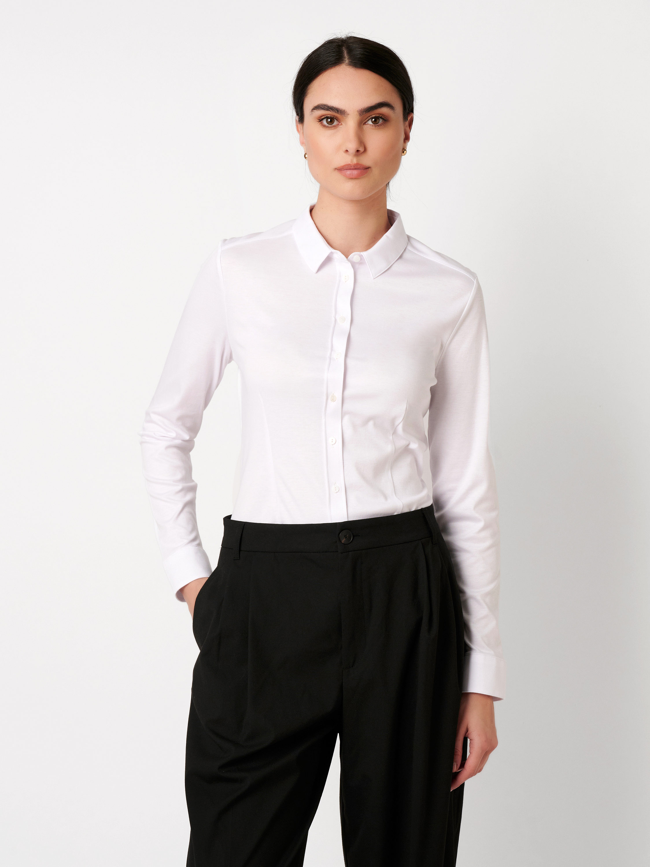 Womens blouse Pia in solid white, front view worn by model