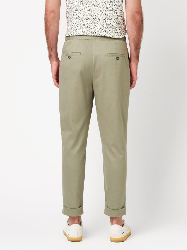 Mens trousers casual in solid green, back view worn by model