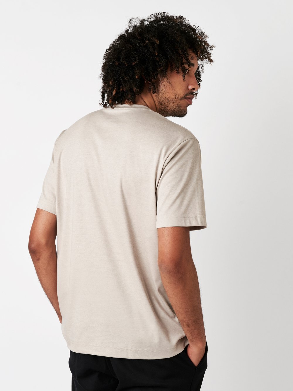 Mens T-shirt casual roundneck in light sonte pique, back view worn by model