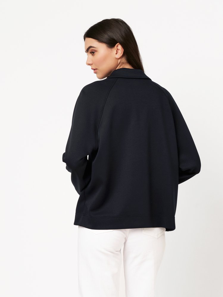 Womens blouse Sina in navy, back view worn by model